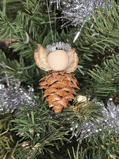 Silver handmade China Fir Tree Cone Angel Christmas Ornament on a Christmas Tree