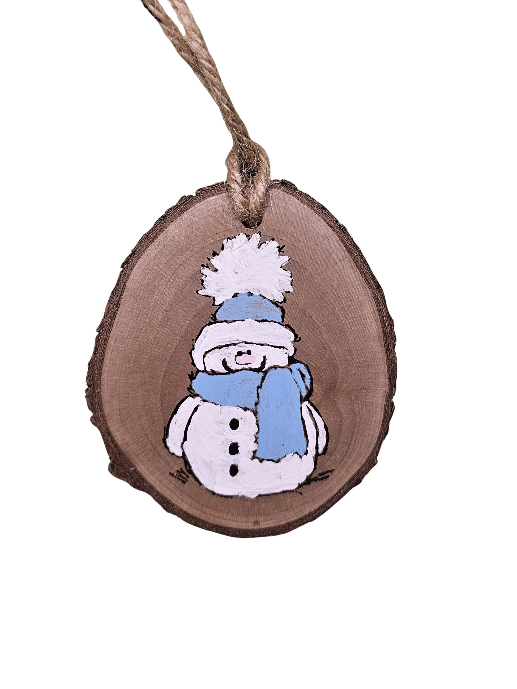 2-3 inch Wood slice Christmas ornament with a snowman hand painted in light blue and white.